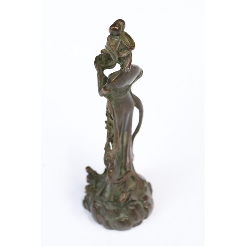 229 - A Chinese ornamental bronze figure of a female, stands approx 12cm in height.