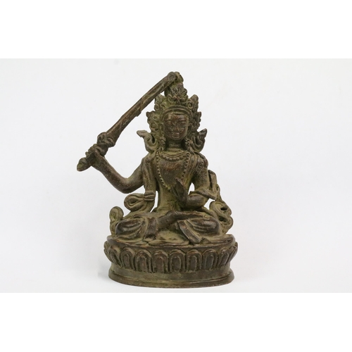 238 - A Chinese ornamental bronze Tara holding sword figure, stands approx 8cm in height.