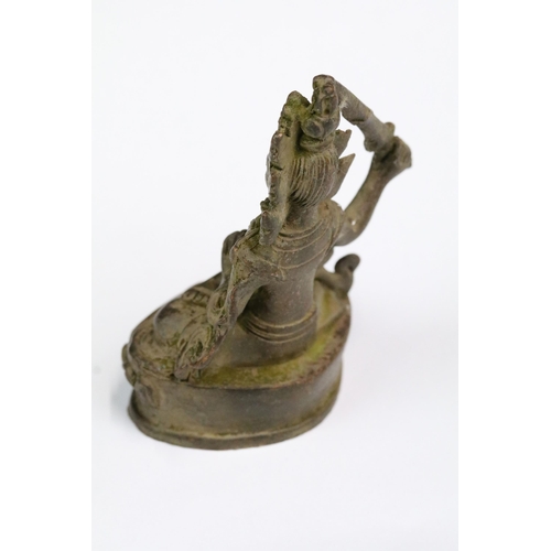 238 - A Chinese ornamental bronze Tara holding sword figure, stands approx 8cm in height.