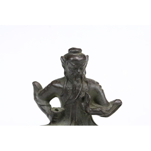 240 - A Chinese ornamental bronze figure / incense burner of man upon tiger, stands approx 6cm in height.