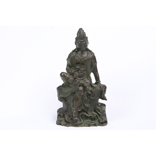 245 - A Chinese ornamental bronze Guanyin figure, stands approx 12cm in height.