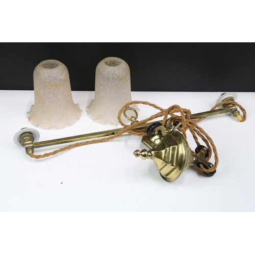 331 - 20th century brass hanging light fitting with two glass shades on pully style system