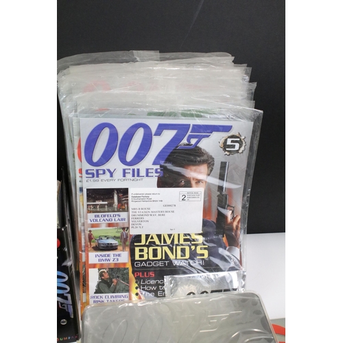 352 - Box of 007 James Bond commemorative and collectors items to include DVD's, Playstation games, Cd, bo... 