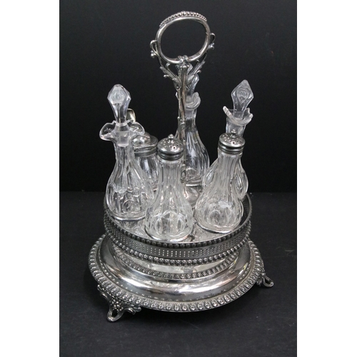 374 - Antique Edwardian silver and glass cruet set on moveable stand with fitted glass bottles, six piece ... 