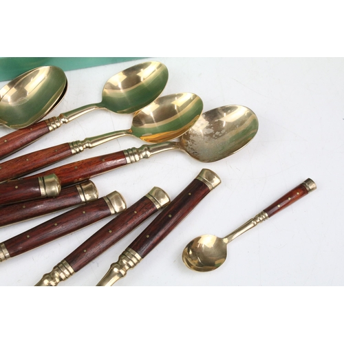 356 - Assortment of wooden handled gold metal cutlery