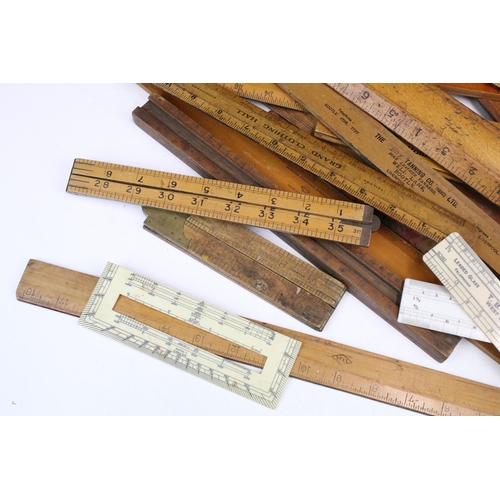 369 - Collection of antique and vintage rulers, set squares and measuring implements to include grand clot... 