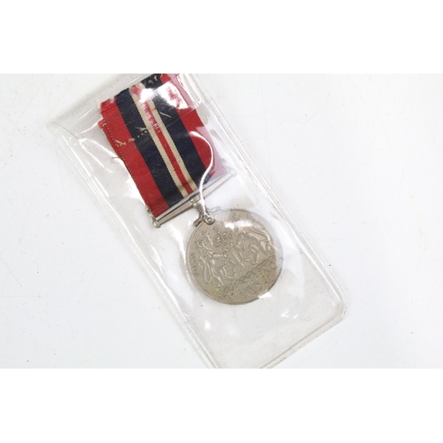 214A - A small collection of British World War Two full size medals together with a selection of military b... 