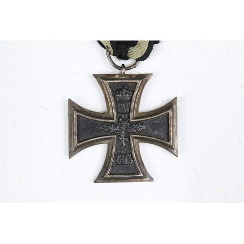 215A - A full size World War Two German 2nd class Iron Cross medal complete with original ribbon.