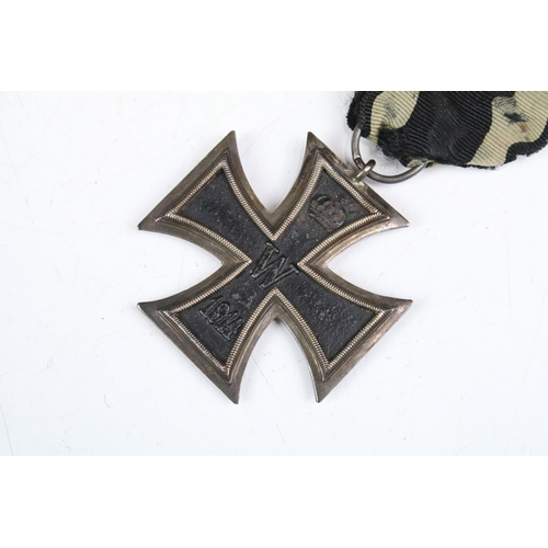 215A - A full size World War Two German 2nd class Iron Cross medal complete with original ribbon.