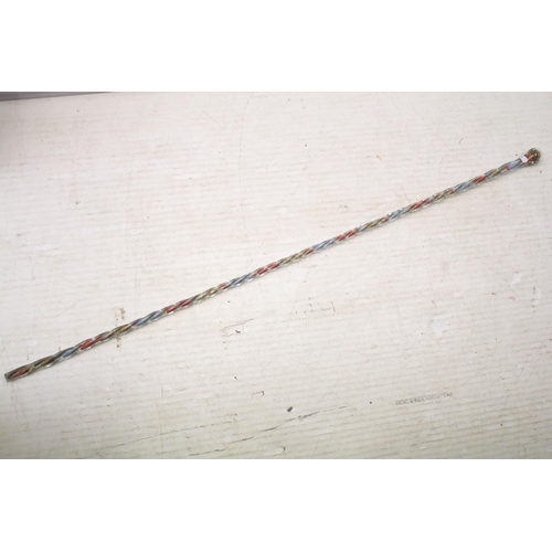 252 - Tall late 19th/early 20th century hollow twisted glass walking stick filled with original bands of r... 