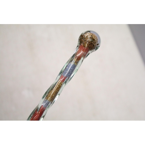 252 - Tall late 19th/early 20th century hollow twisted glass walking stick filled with original bands of r... 