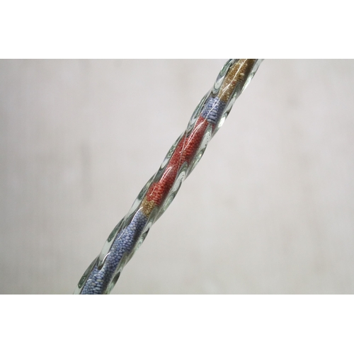 252 - Tall late 19th/early 20th century hollow twisted glass walking stick filled with original bands of r... 