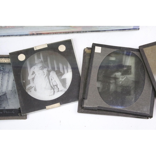 254 - A collection of glass magic lantern slides to include Boer war sets within original boxes and real p... 