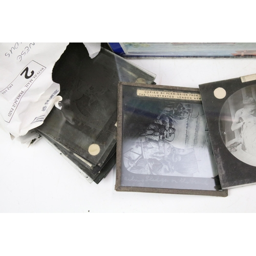 254 - A collection of glass magic lantern slides to include Boer war sets within original boxes and real p... 