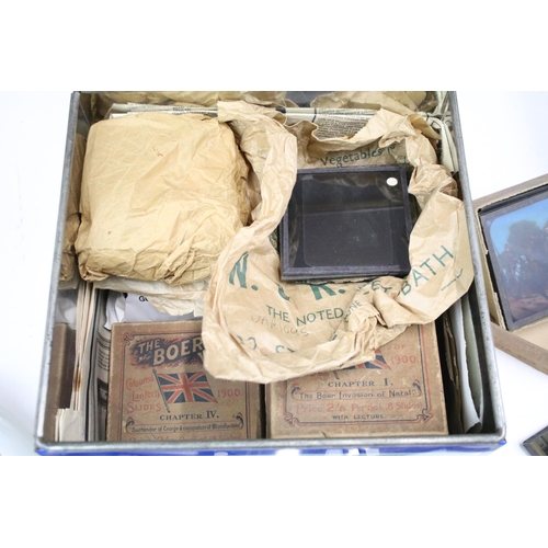 254 - A collection of glass magic lantern slides to include Boer war sets within original boxes and real p... 