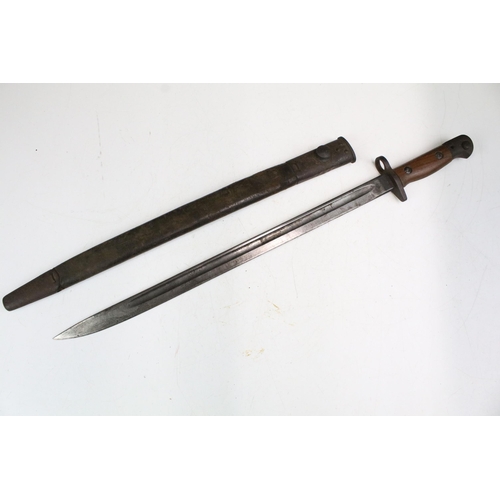 266 - A British World War One 1907 pattern Wilkinson bayonet complete with leather scabbard.