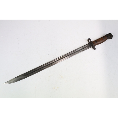 266 - A British World War One 1907 pattern Wilkinson bayonet complete with leather scabbard.