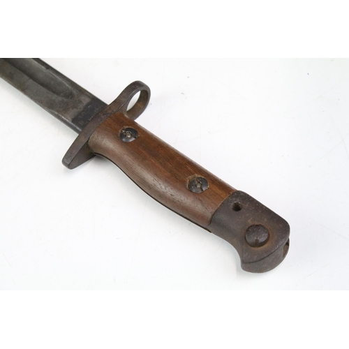 266 - A British World War One 1907 pattern Wilkinson bayonet complete with leather scabbard.