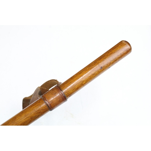 273A - A mid 20th century wooden sword / swagger stick with leather handle, double edged blade measures app... 