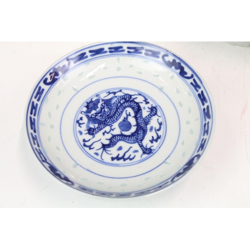 104 - Large collection of Oriental chinaware to include donut teapots, large selection of blue and white p... 