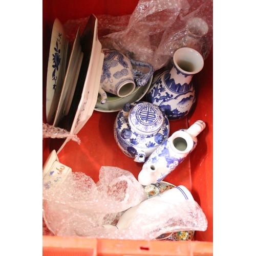 104 - Large collection of Oriental chinaware to include donut teapots, large selection of blue and white p... 