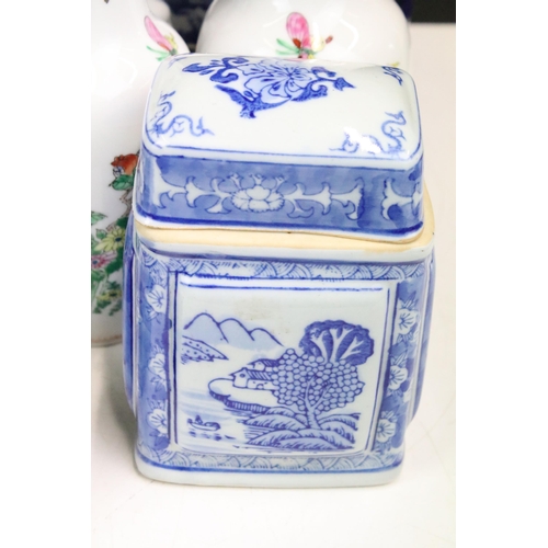 104 - Large collection of Oriental chinaware to include donut teapots, large selection of blue and white p... 