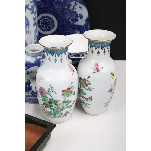 104 - Large collection of Oriental chinaware to include donut teapots, large selection of blue and white p... 