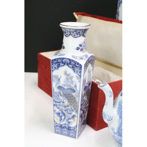 104 - Large collection of Oriental chinaware to include donut teapots, large selection of blue and white p... 