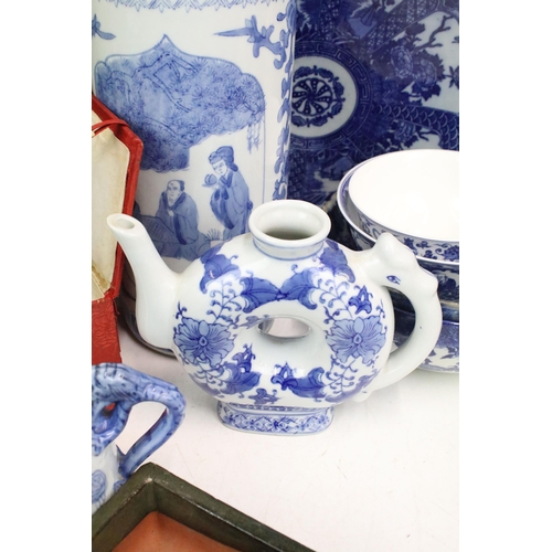 104 - Large collection of Oriental chinaware to include donut teapots, large selection of blue and white p... 