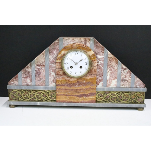 131 - Art Deco style marble two train clock, with gilt metal mounts together with a pair of marble pedesta... 