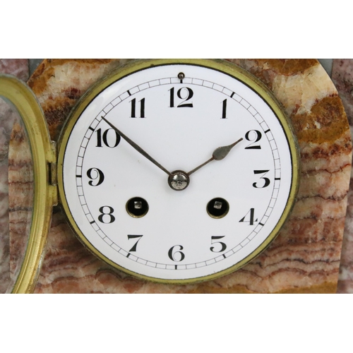 131 - Art Deco style marble two train clock, with gilt metal mounts together with a pair of marble pedesta... 