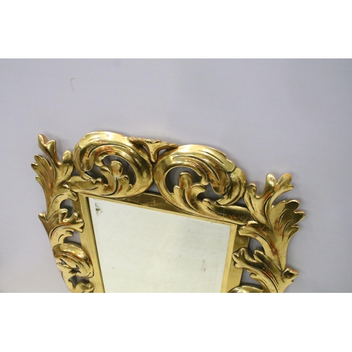 159 - Large decorative carved and gilded wall mirror, H 74cm, W 62cm