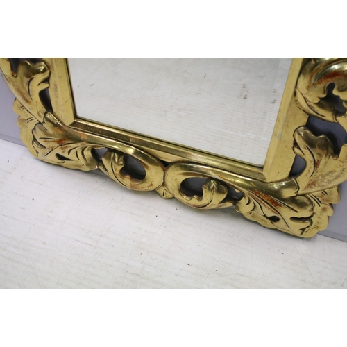 159 - Large decorative carved and gilded wall mirror, H 74cm, W 62cm