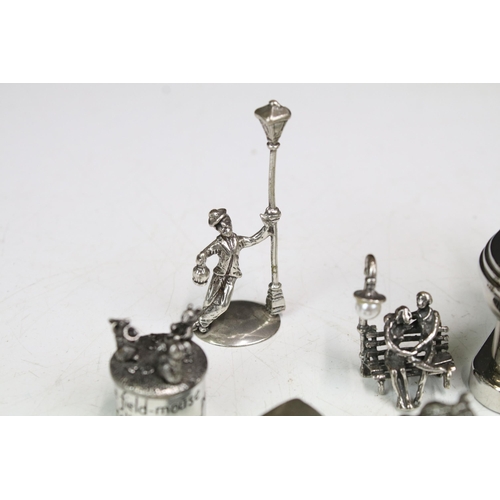 277 - A small group of mainly silver plated miniature collectables to include cars, figures and two baby t... 