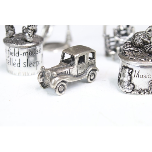 277 - A small group of mainly silver plated miniature collectables to include cars, figures and two baby t... 