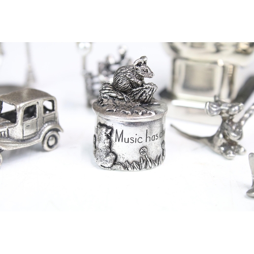 277 - A small group of mainly silver plated miniature collectables to include cars, figures and two baby t... 