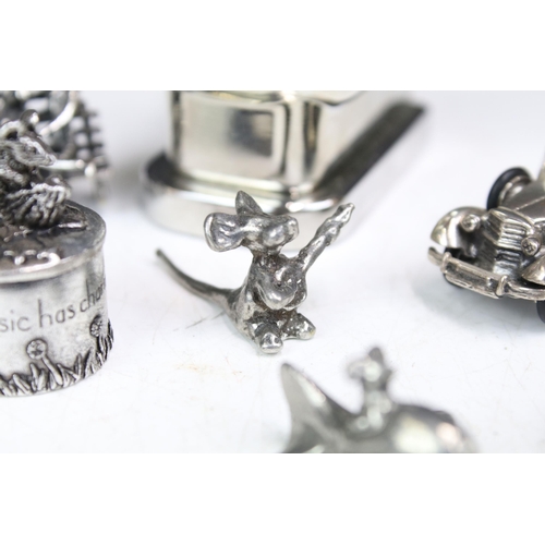 277 - A small group of mainly silver plated miniature collectables to include cars, figures and two baby t... 