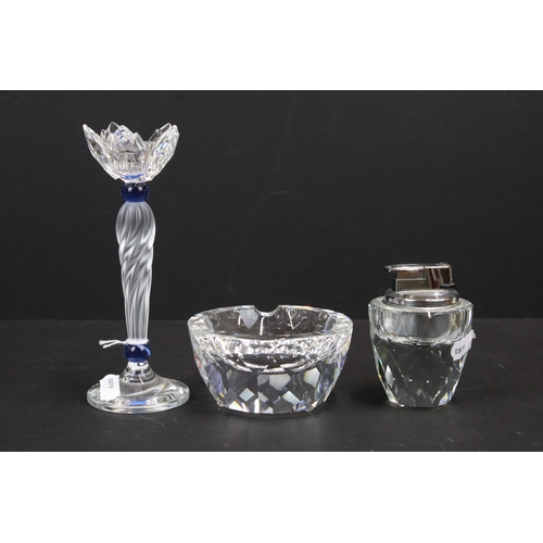 283 - Collection of Swarovski, comprising: candlestick with twisted stem, 16.5cm high, table lighter, 9cm ... 