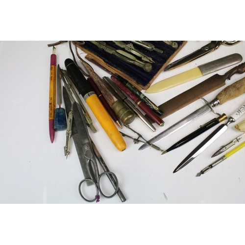 291 - A collection of mixed collectables to include vintage pens, drawing intruments, folding rule, inkwel... 