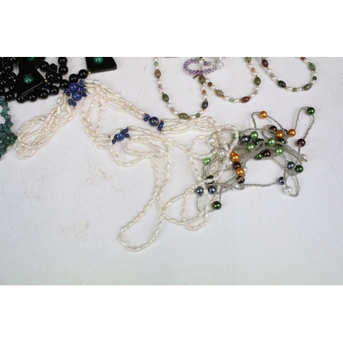 292 - A collection of gemstone and pearl necklaces to include amethyst and malachite examples.