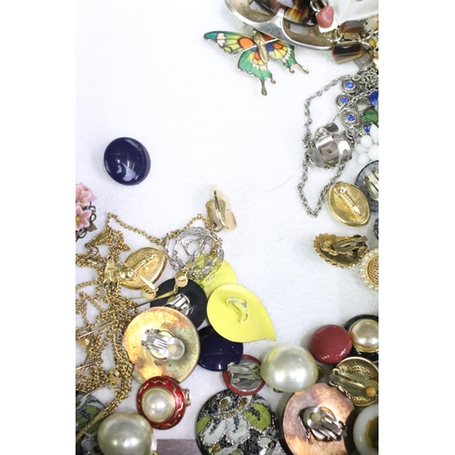 299 - A collection of vintage and contemporary costume jewellery to include beaded necklaces, earrings, br... 