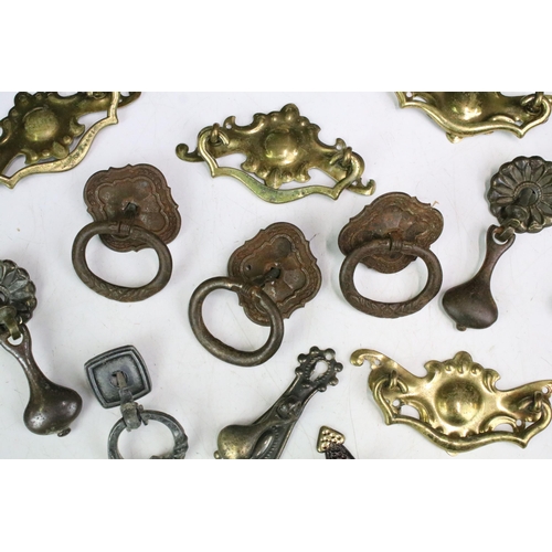 301 - Collection of furniture handles including set of four brass handles with shaped back plates, set of ... 