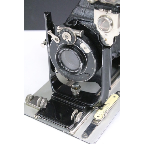 303 - An early to mid 20th century bellows camera by Taylor Taylor & Hobson Ltd complete with leather case... 