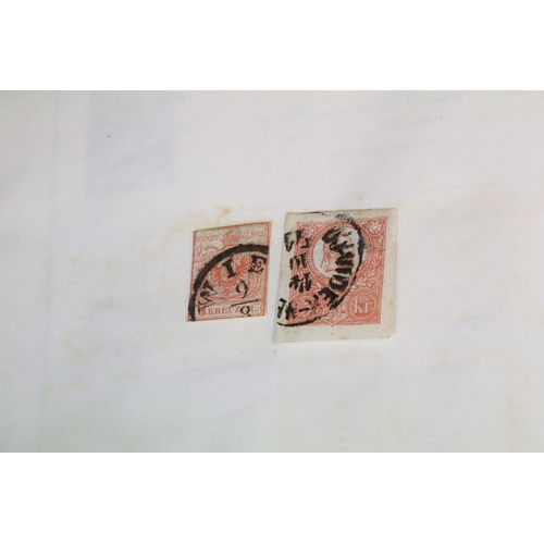 306 - A collection of stamps to include a Strand album with contents to include many early world and commo... 