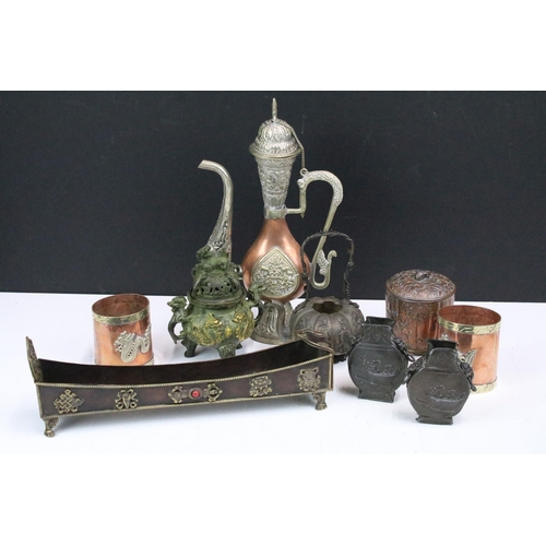 308 - A small collection of mixed metal ware to include copper cups, white metal oriental teapot, brass se... 