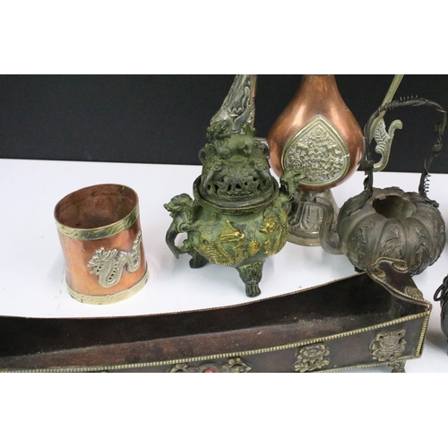 308 - A small collection of mixed metal ware to include copper cups, white metal oriental teapot, brass se... 