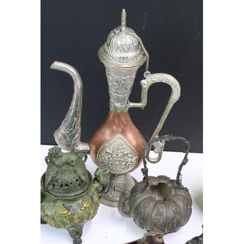 308 - A small collection of mixed metal ware to include copper cups, white metal oriental teapot, brass se... 