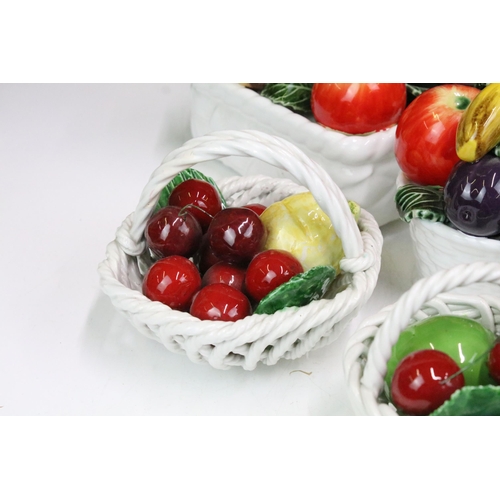 87 - Selection of ten fruit inspired ceramics to include a footed fruit basket display by All Art Trad Co... 