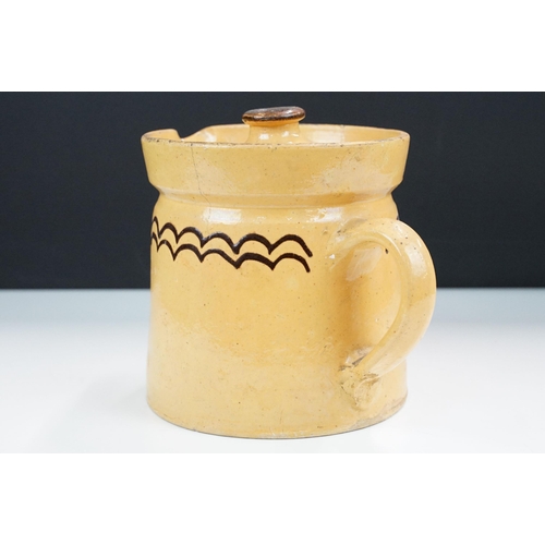 29 - Slipware lidded stoneware pottery beer jug pitcher, with decorative border H 16.5cm