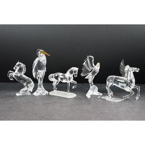 34 - Collection of five Swarovski crystal figurines to include a Pegasus, eagle, horse standing, horse re... 